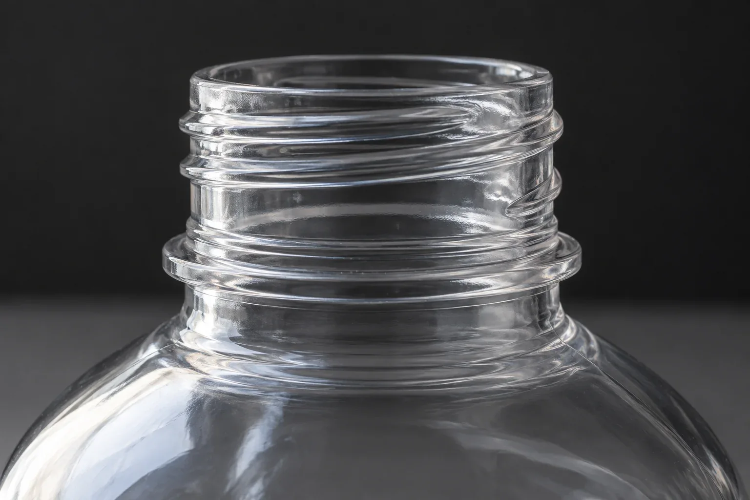 Close view of an open bottle neck and shoulder